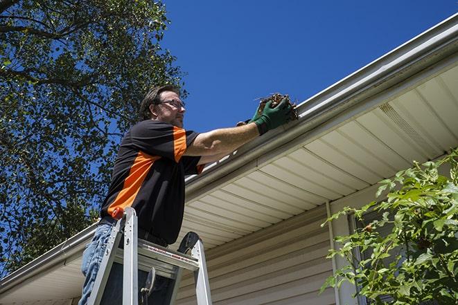 a close-up of a gutter being fixed with tools in Chicago Heights, IL